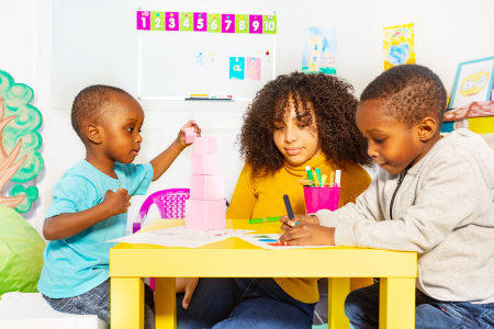 Woman with 2 kid doing an activity
